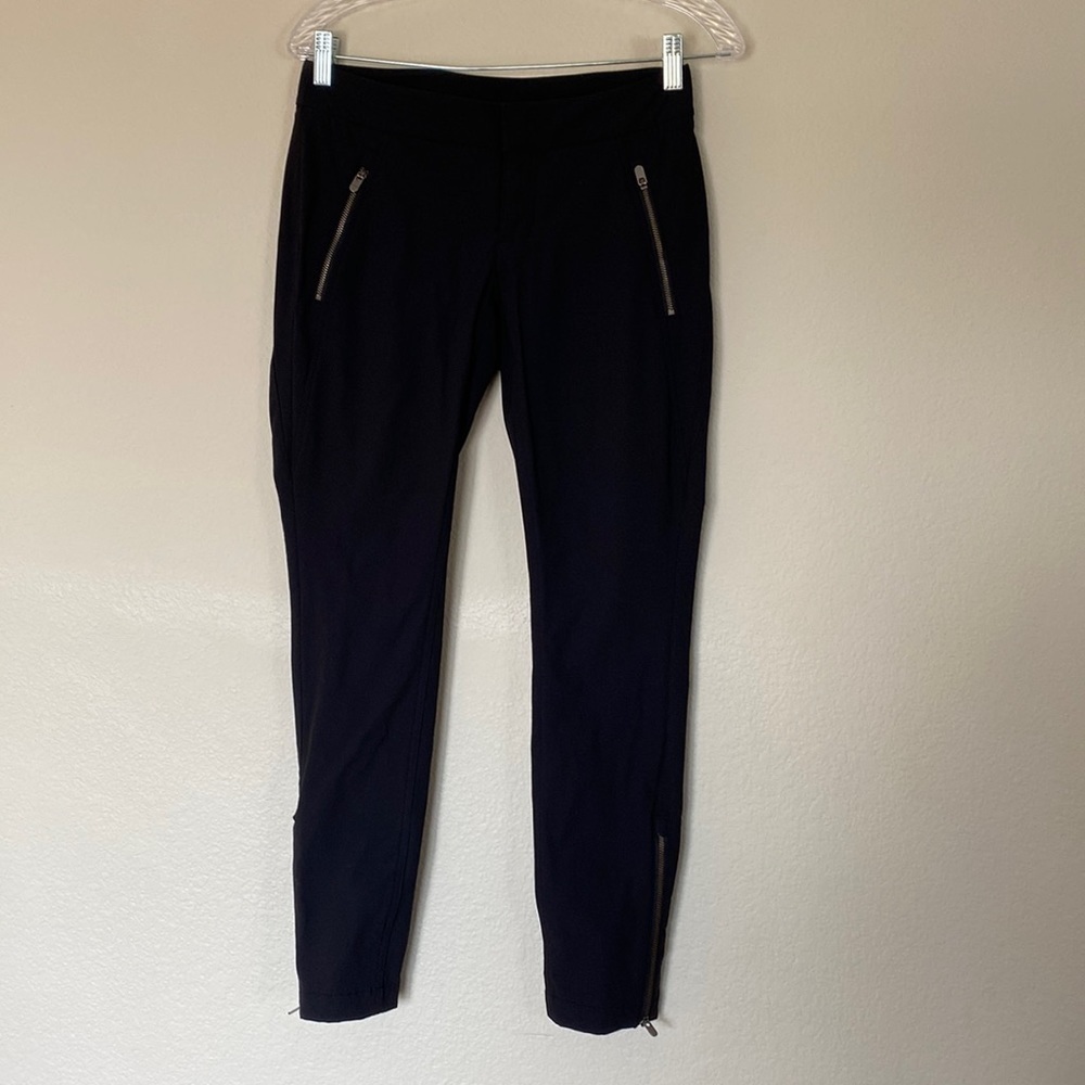 Athleta black skinny nylon trousers size 2 with zippers on bottom of leg. EUC